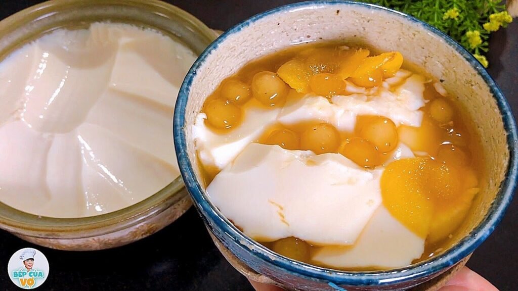 Silky tofu pudding in ginger syrup, a light and refreshing dessert.