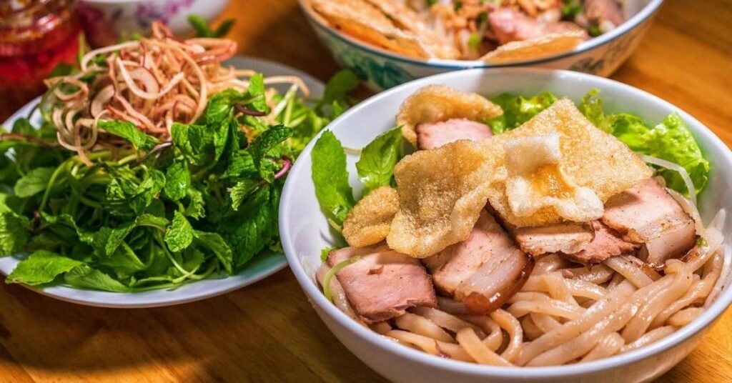 This iconic noodle dish has become synonymous with the city itself. At first glance, it resembles other Vietnamese noodle dishes, but one bite quickly reveals its uniqueness.
