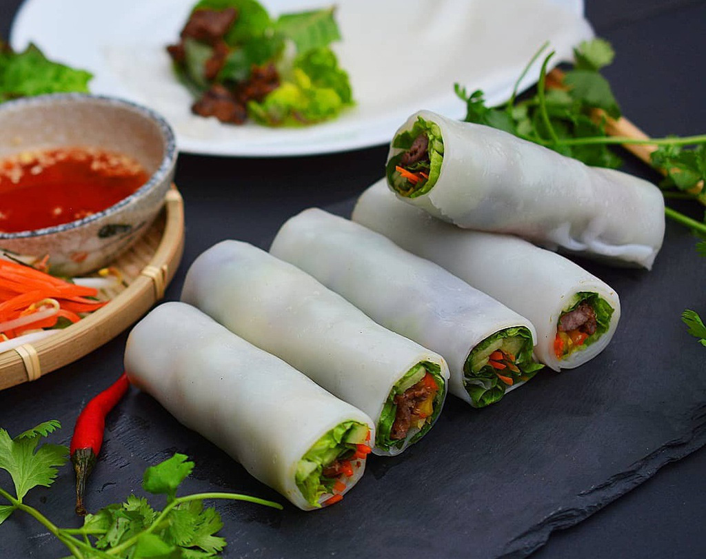 Like a fresh, healthy twist on traditional pho. Soft rice noodle sheets wrapped around savory beef and fresh herbs—Phở Cuốn is perfect for a light lunch.