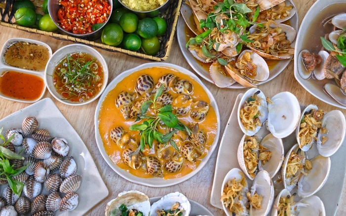 Lost in the seafood maze of Vinh Khanh Street. Sizzling grills, bustling crowds, and endless delicious dishes