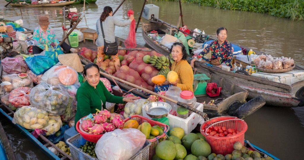Vendors gathering at a floating market in the early morning.
