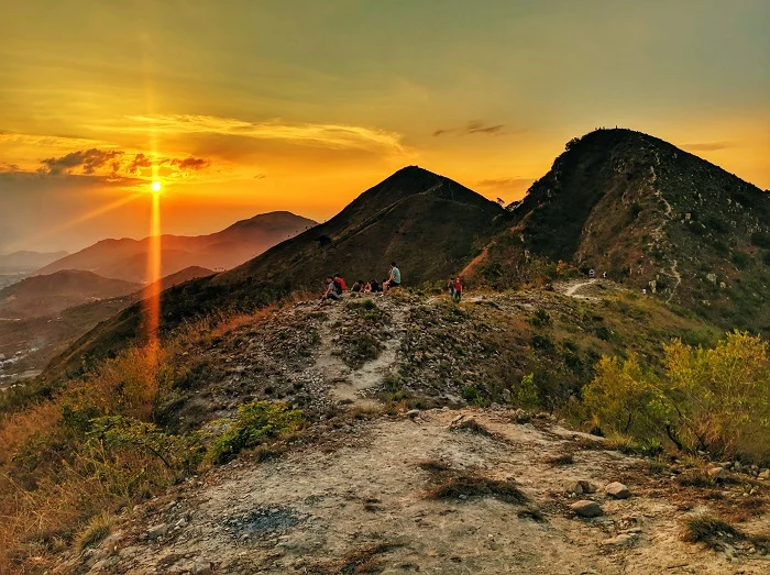 Catching the golden hour from the ridges of Co Tien Mountain. Watching the city lights slowly wake up as the sun dips below the horizon. The climb was tough, but this view is pure magic.