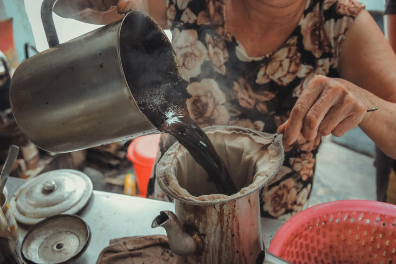 No fancy espresso machines here. Just a coal stove, a clay pot, and a cloth strainer. The result? A cup of 'cà phê vợt' so rich, smooth, and full of soul that you’ll never look at coffee the same way again.